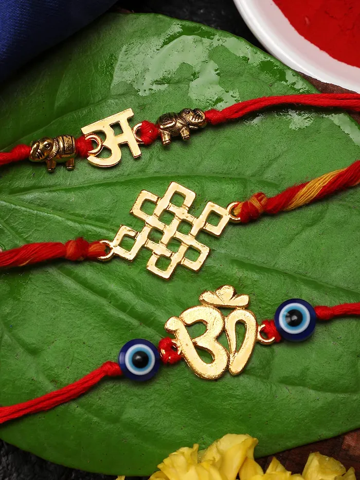 Yellow Chimes Combo of 3 Pcs Handmade Dori Worked Gold Toned OM Initial Letter A and Celtic Design Evil Eye Beads Rakhi for Brother with Roli Chawal Red Gold Medium YCTJRK33BHAYGL Yellow Chimes Necklaces