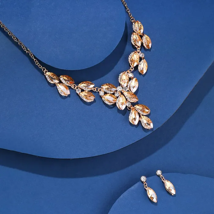 Yellow Chimes Jewellery Set For Women Gold Toned Oval Shaped Crystal Studded Necklace Set With Earring For Women and Girls Yellow Chimes Necklaces