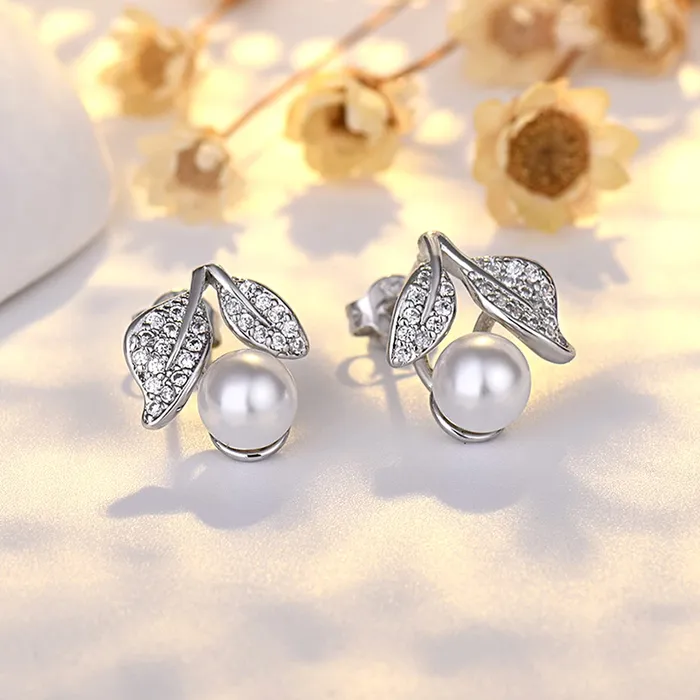 Yellow Chimes Rings Yellow Chimes Earrings for Women and Girls Silver Crystal Stud Earrings for Women Silver Toned Pearl Leafy Shaped Studs Earrings Birthday Gift for girls and women Anniversary Gift for Wife